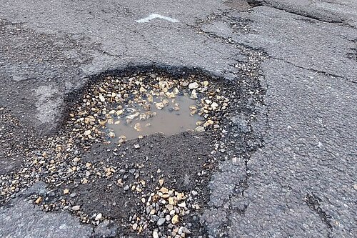 A pothole in the road in Fleet