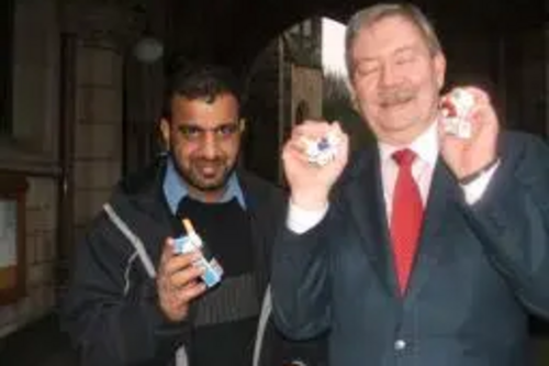 Councillor Taylor - delighted at the smoking ban and a not so delighted Councillor Khalid Mahmood.