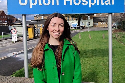 Chelsea Whyte, Lib Dem Parliamentary Candidate, outside Upton Hospital