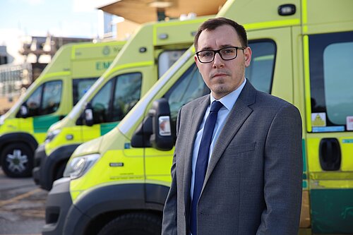 Tom stood by ambulances outside Harrogate hospital