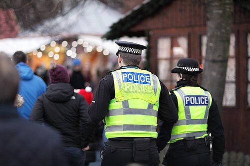 Police standing outside a fair