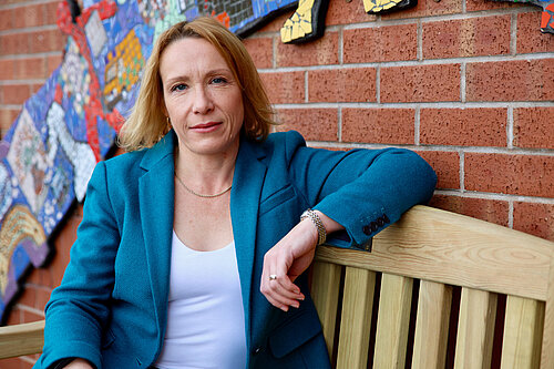 Helen Morgan MP sitting on a bench in North Shropshire