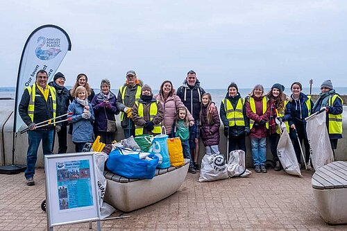 Photo of volunteer beach clean up crew