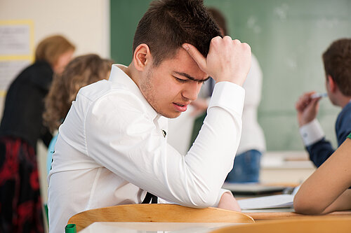 A boy at school in distress.