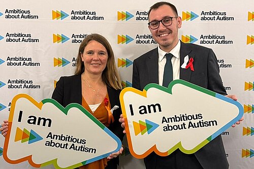 Tom Gordon MP with Vikki Slade MP with signs reading "I am Ambitious about Autism