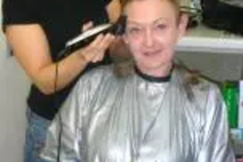 Julia having her head shaved for charity