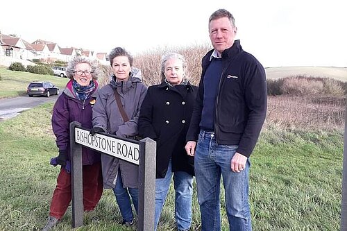 James with LibDem campaigners all looking very windswept by "Bishopstone Road" sign