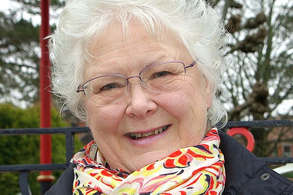 Molly Rennie in 2019 wearing a multicoloured scarf and blue jacket