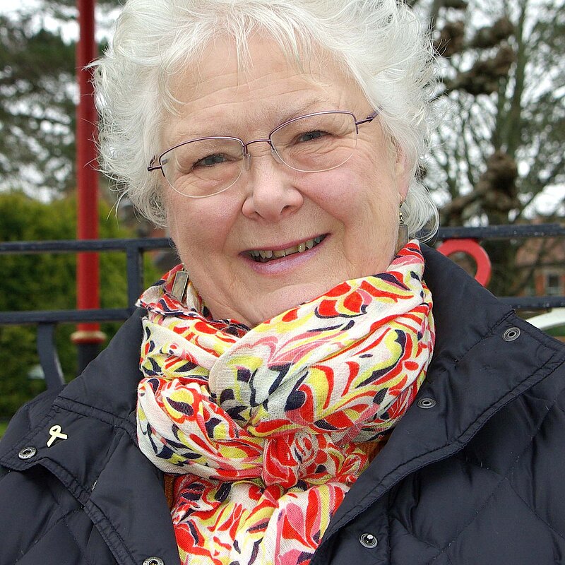 Molly Rennie in 2019 wearing a multicoloured scarf and blue jacket