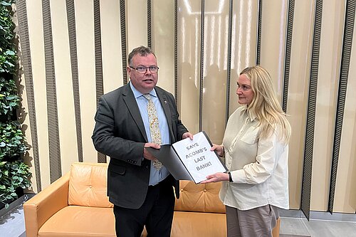 Andrew Waller handing in his petition to the Regional Public Affairs Manager at the Halifax offices in Leeds