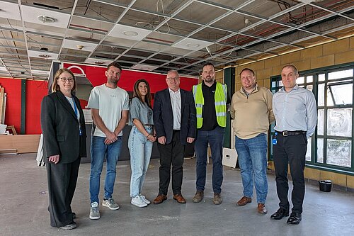 Ian Roome with the bus station team