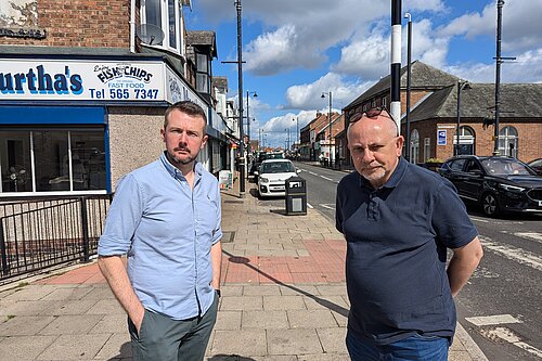 Councillors Martin Haswell and Steve Donkin standing on St Lukes Terrace in Pallion with shops behind them